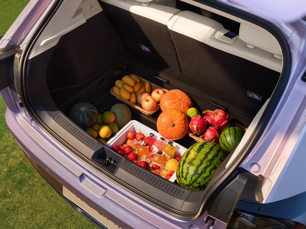 Large boot space with hidden-sunken storage of teh ARCFOX T1 electric SUV carrying a large fruit tray