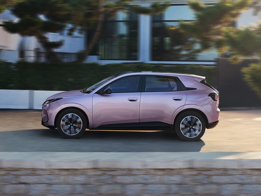 Side view of a purple all-electric ARCFOX T1 SUV driving on a suburban street