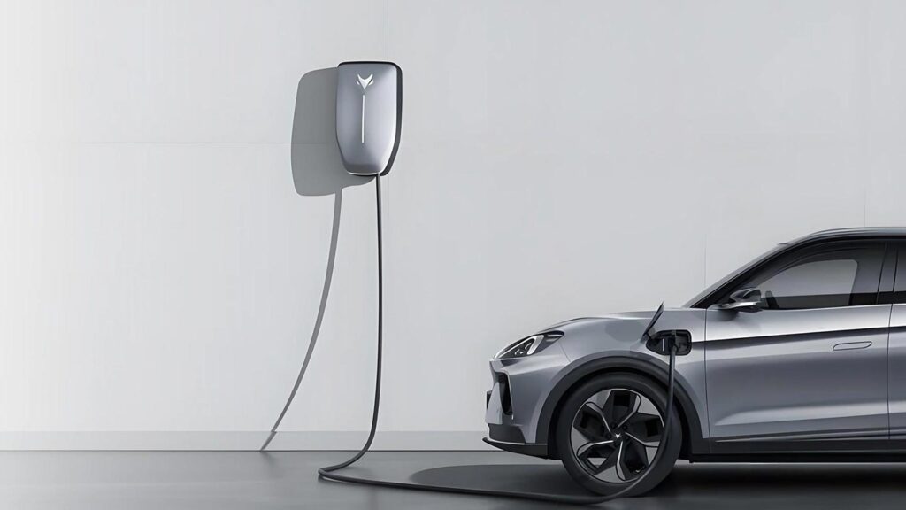 Side view of a silver ARCFOX T1 electric SUV plugged into a wallbox charger