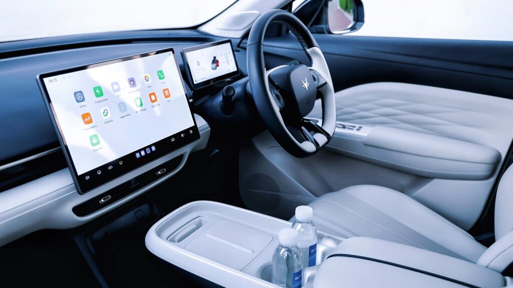 Interior view of the ARCFOX T1 electric SUV with white leather seats and large central touchscreen